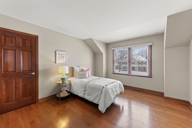 bedroom with wood-type flooring