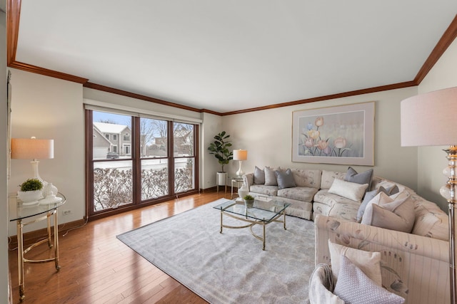 living room with wood-type flooring and crown molding