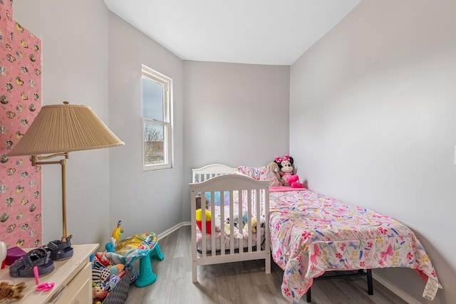 bedroom with wood-type flooring