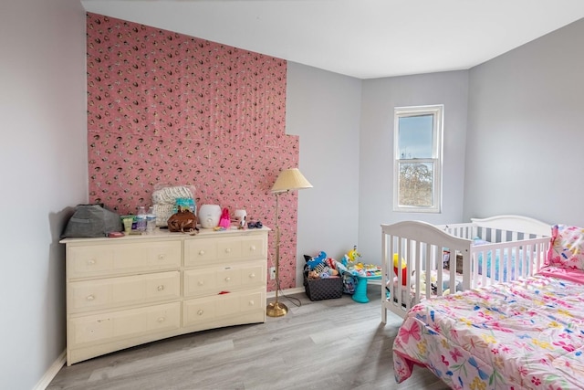 bedroom with light hardwood / wood-style flooring