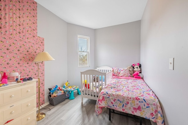 bedroom with light hardwood / wood-style flooring