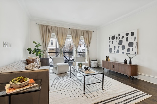 living room with dark hardwood / wood-style flooring and ornamental molding