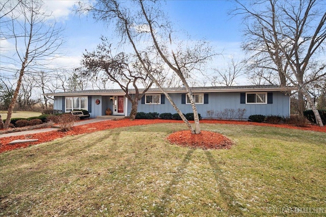 ranch-style house with a front lawn