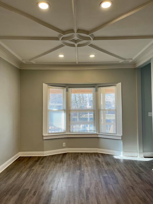 unfurnished room with ornamental molding, dark wood-type flooring, and coffered ceiling