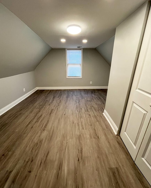 bonus room featuring hardwood / wood-style flooring and lofted ceiling