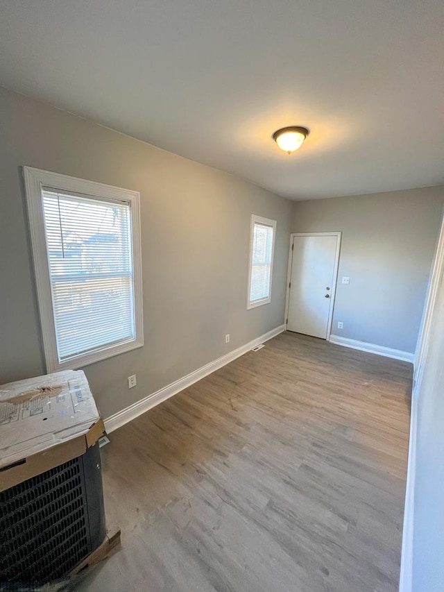 unfurnished room featuring light wood-type flooring