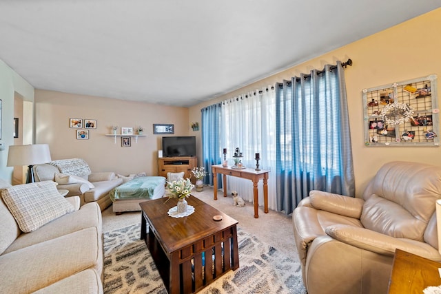 living room featuring light carpet