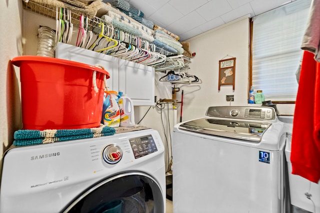 washroom with washer and clothes dryer