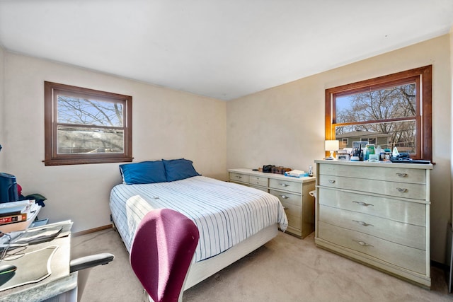 carpeted bedroom with multiple windows