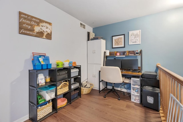 office with hardwood / wood-style flooring