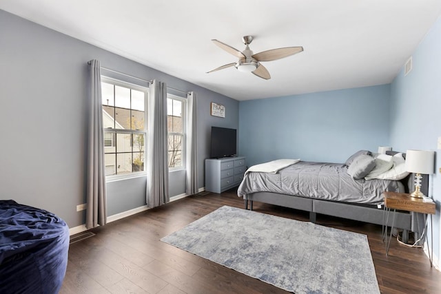 bedroom with ceiling fan and dark wood-type flooring