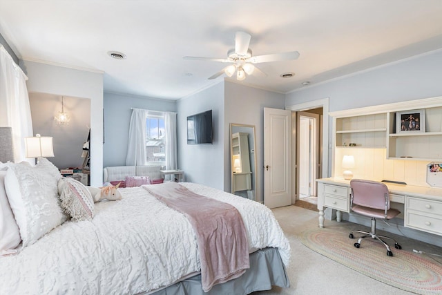 carpeted bedroom featuring crown molding and ceiling fan