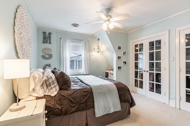 bedroom with crown molding, light carpet, ceiling fan, and french doors