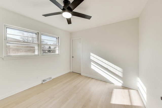 unfurnished room featuring ceiling fan and light wood-type flooring