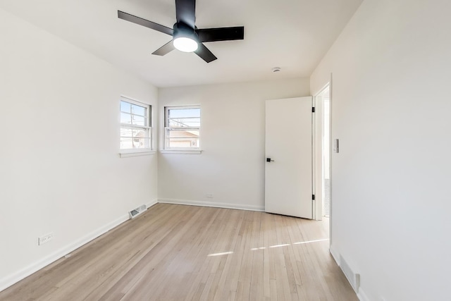 unfurnished room with ceiling fan and light hardwood / wood-style flooring