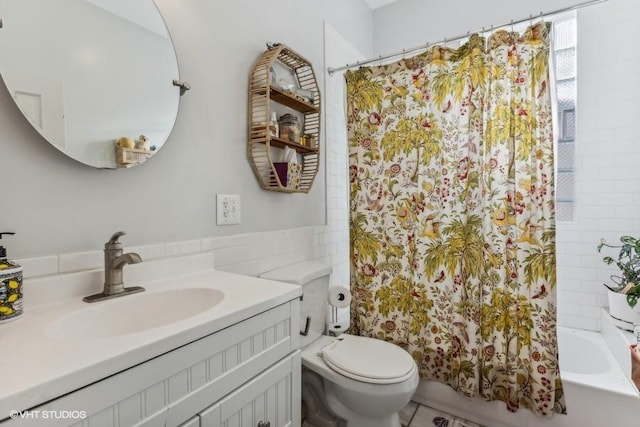 full bathroom with shower / bath combo, vanity, toilet, and tile walls