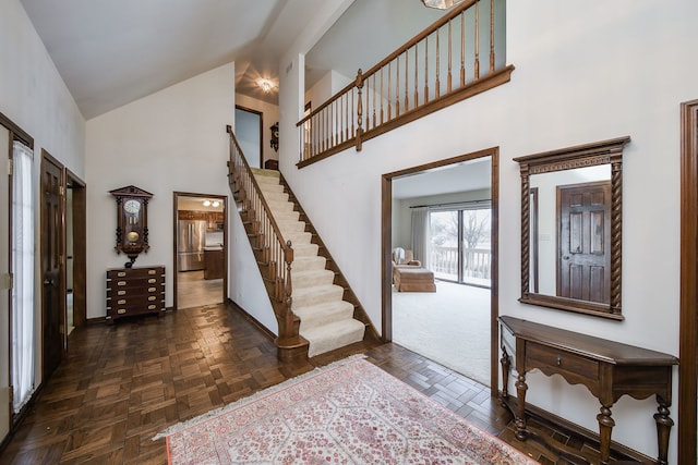 foyer entrance featuring dark parquet floors