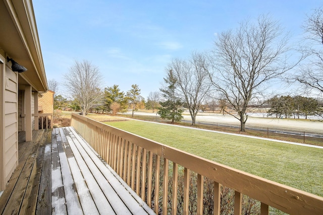 wooden deck featuring a yard