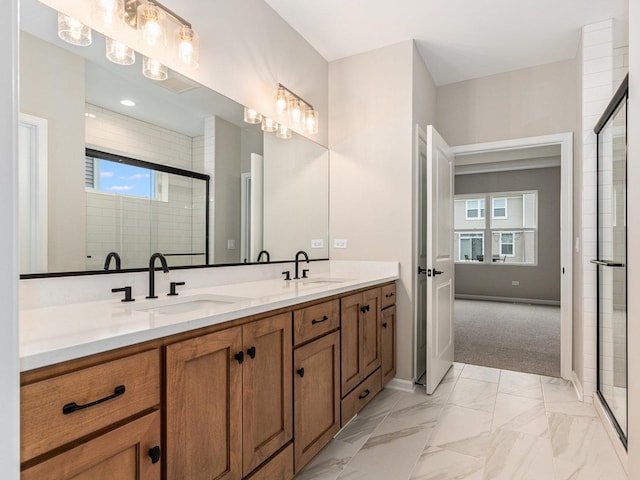 bathroom featuring walk in shower and vanity