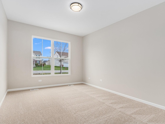 unfurnished room with carpet floors