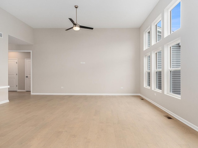 spare room featuring light wood-type flooring and ceiling fan