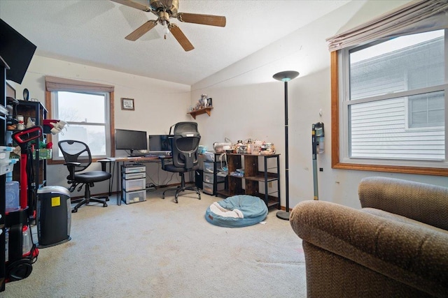 carpeted office with a textured ceiling, ceiling fan, and lofted ceiling