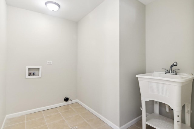 laundry room featuring hookup for a washing machine and light tile patterned flooring