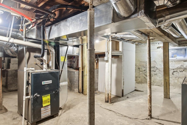 basement featuring heating unit