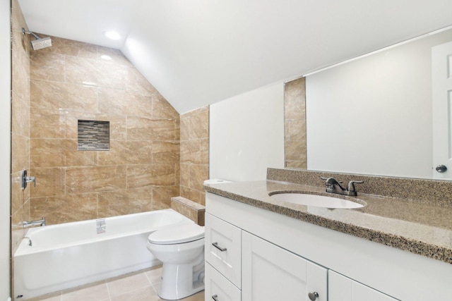 full bathroom with toilet, vaulted ceiling, tile patterned floors, tiled shower / bath, and vanity