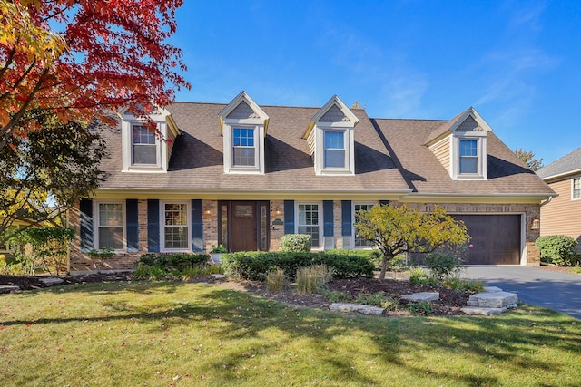 new england style home with a front lawn