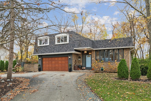 view of front of property with a garage