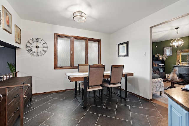 dining area featuring an inviting chandelier