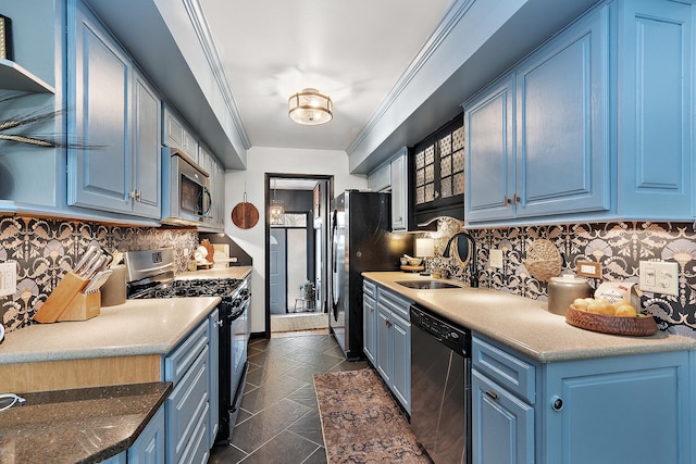 kitchen with sink, stainless steel appliances, blue cabinets, backsplash, and dark tile patterned flooring