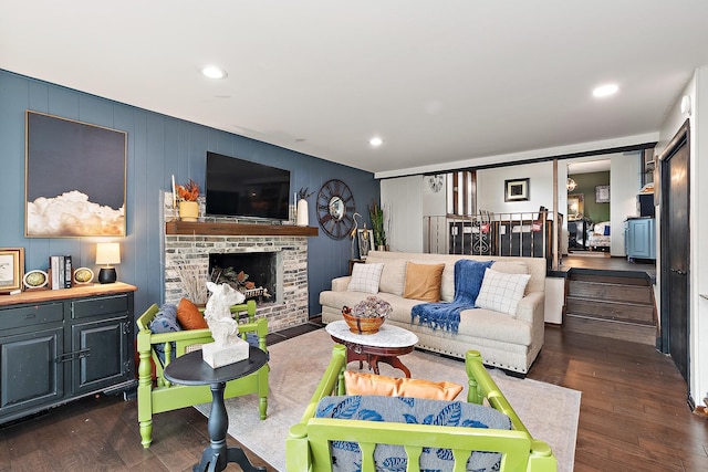 living room featuring a fireplace and dark hardwood / wood-style flooring