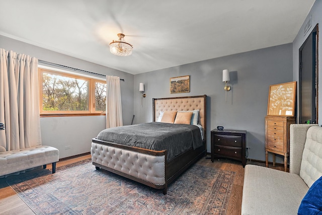 bedroom with dark wood-type flooring