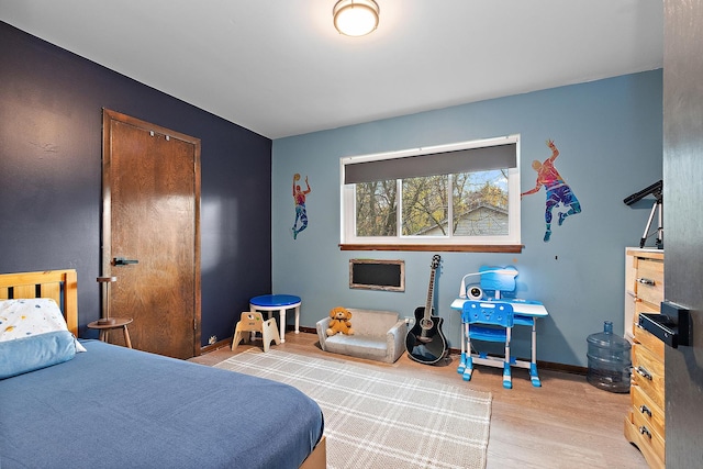 bedroom featuring light hardwood / wood-style floors