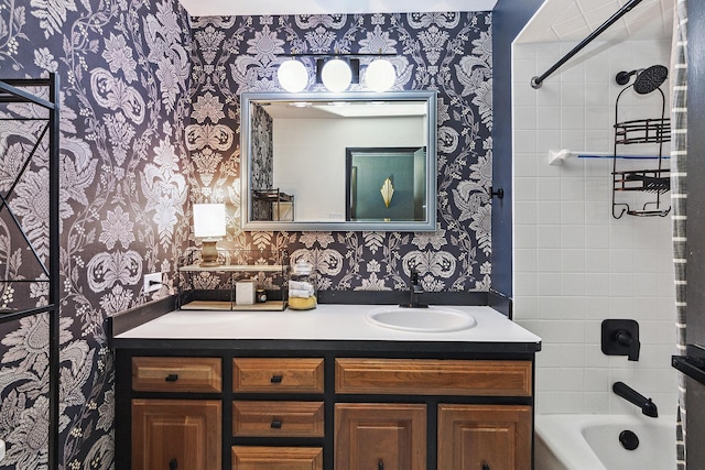 bathroom with vanity and tiled shower / bath combo