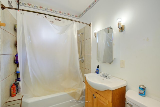 full bathroom featuring shower / tub combo with curtain, vanity, and toilet