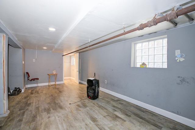 basement featuring hardwood / wood-style flooring