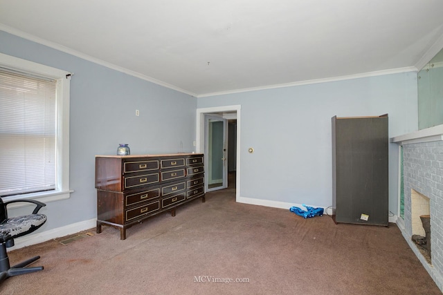 interior space with carpet flooring, a fireplace, plenty of natural light, and crown molding