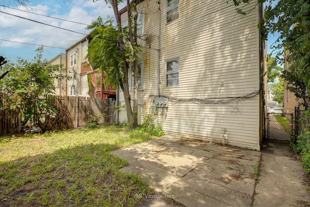 view of home's exterior featuring a yard and a patio area