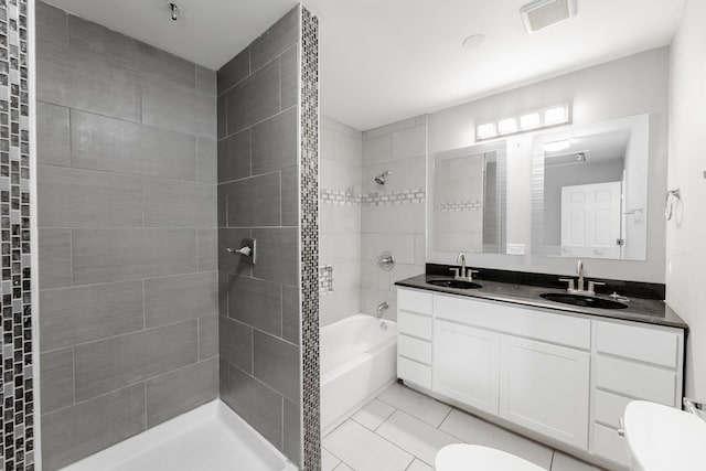 bathroom with tile patterned flooring, vanity, and toilet