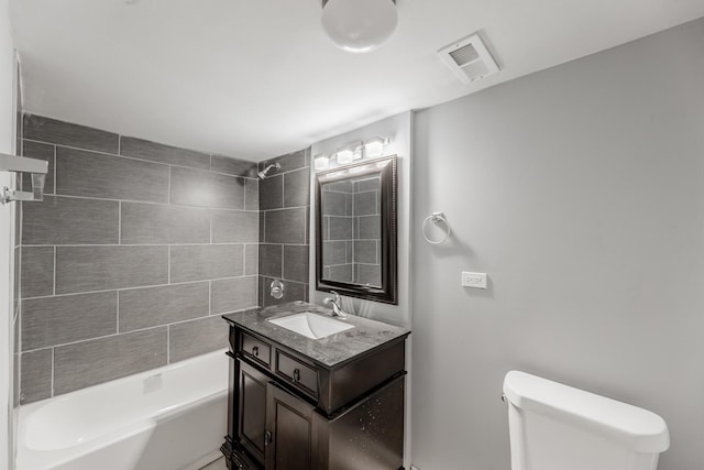 full bathroom featuring shower / tub combination, vanity, and toilet