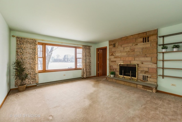 unfurnished living room with carpet flooring and a stone fireplace