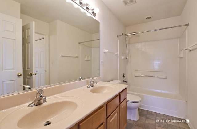 full bathroom with vanity,  shower combination, and toilet