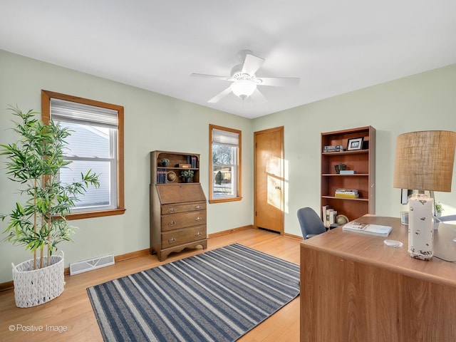 office area with ceiling fan and light wood-type flooring