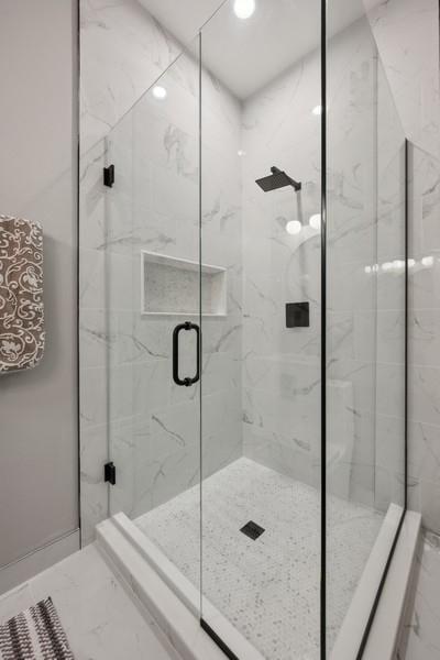 bathroom with an enclosed shower