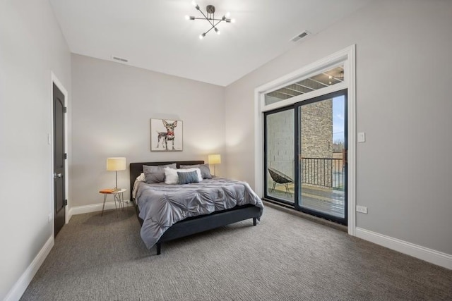 carpeted bedroom featuring access to outside and a chandelier