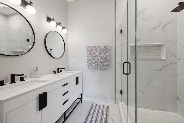 bathroom featuring vanity and a shower with shower door