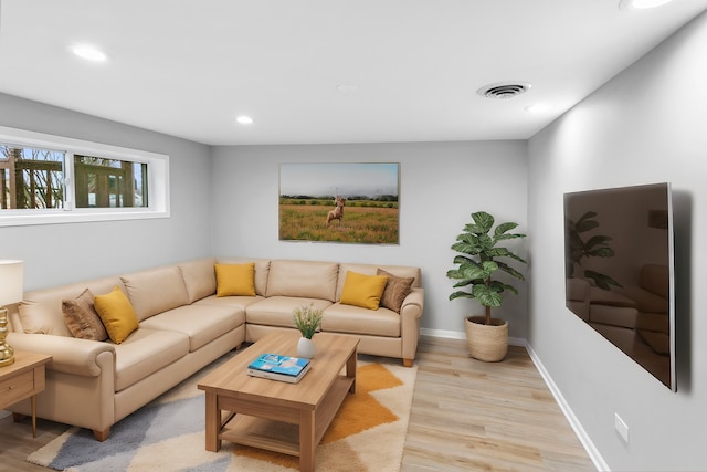 living room with light hardwood / wood-style flooring